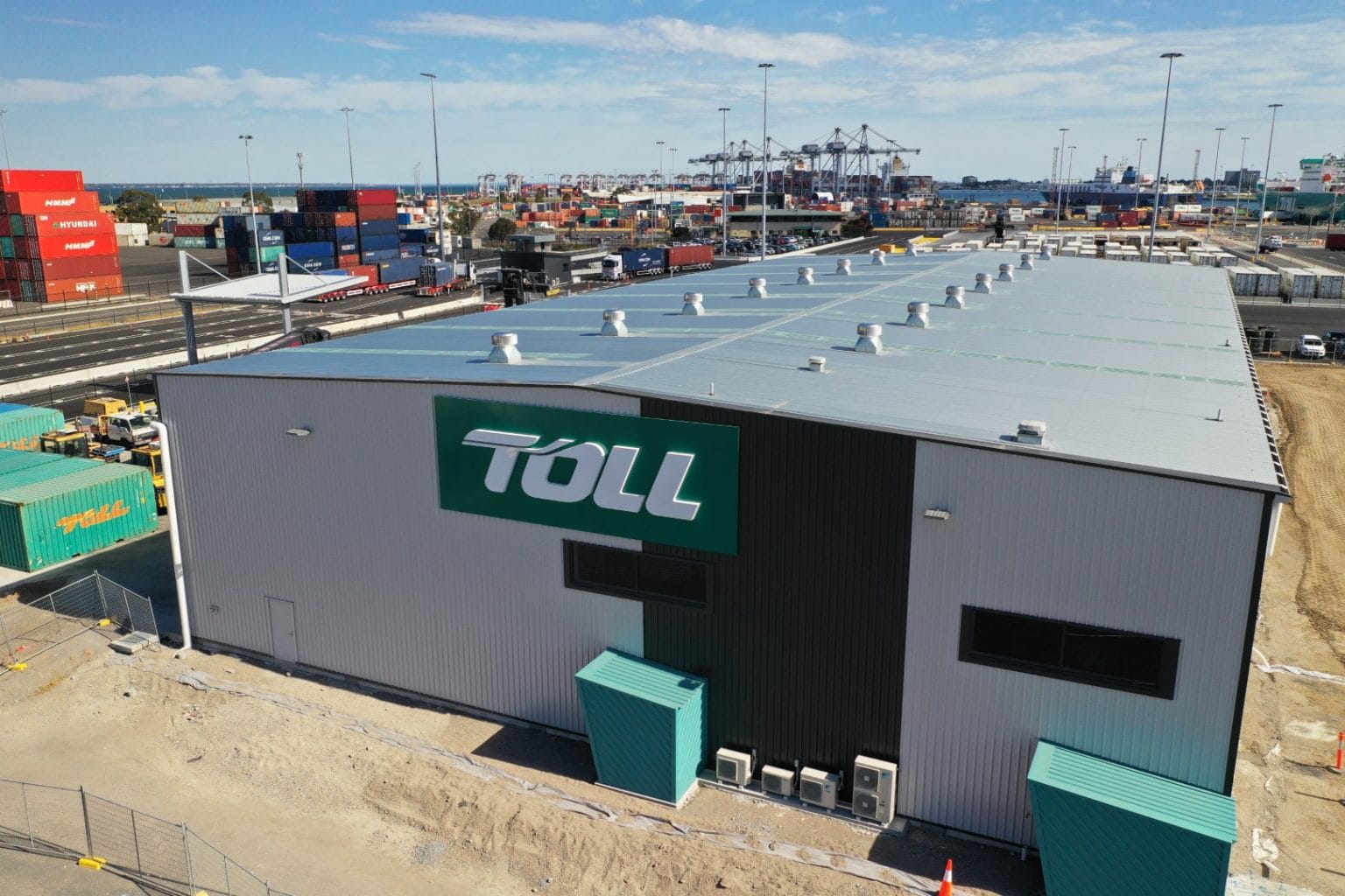 Green TOLL logo marks front of gatehouse 1